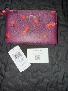 COACH Plum Floral Zip Wristlet with Red-Orange Blooms